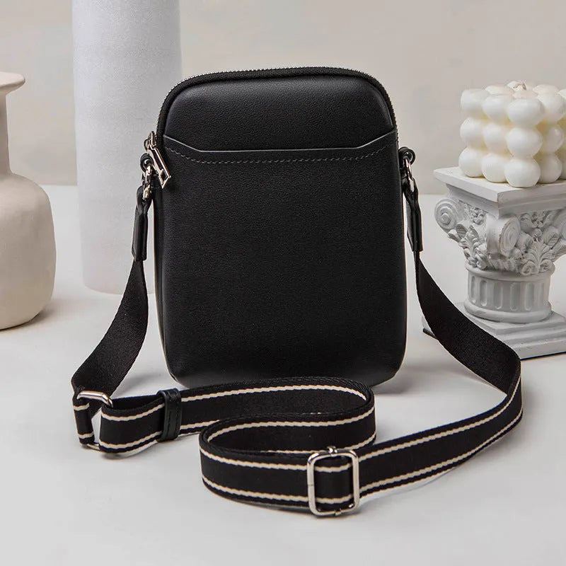 Solid colour PU leather crossbody phone bag for women in beige, showing front view.