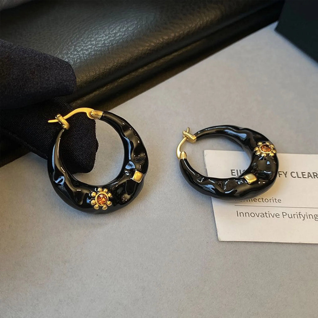 Hong Kong style retro ear studs with rhinestone inlay and dripping oil texture in black and red colours