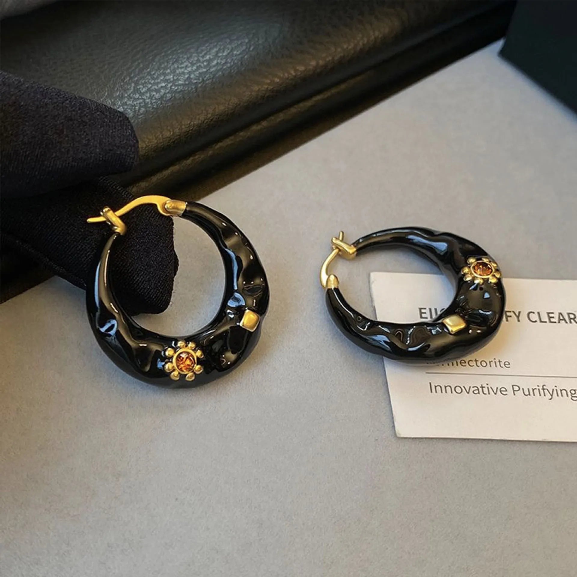 Hong Kong style retro ear studs with rhinestone inlay and dripping oil texture in black and red colours