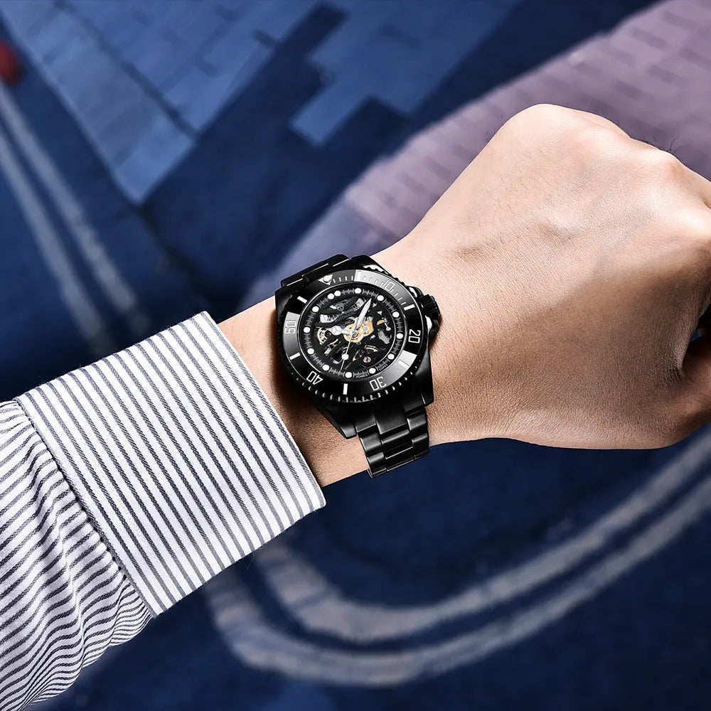 PAGANI Steel Band Mechanical Watch with black dial, luminous hands, and screw-down crown on a stainless steel band