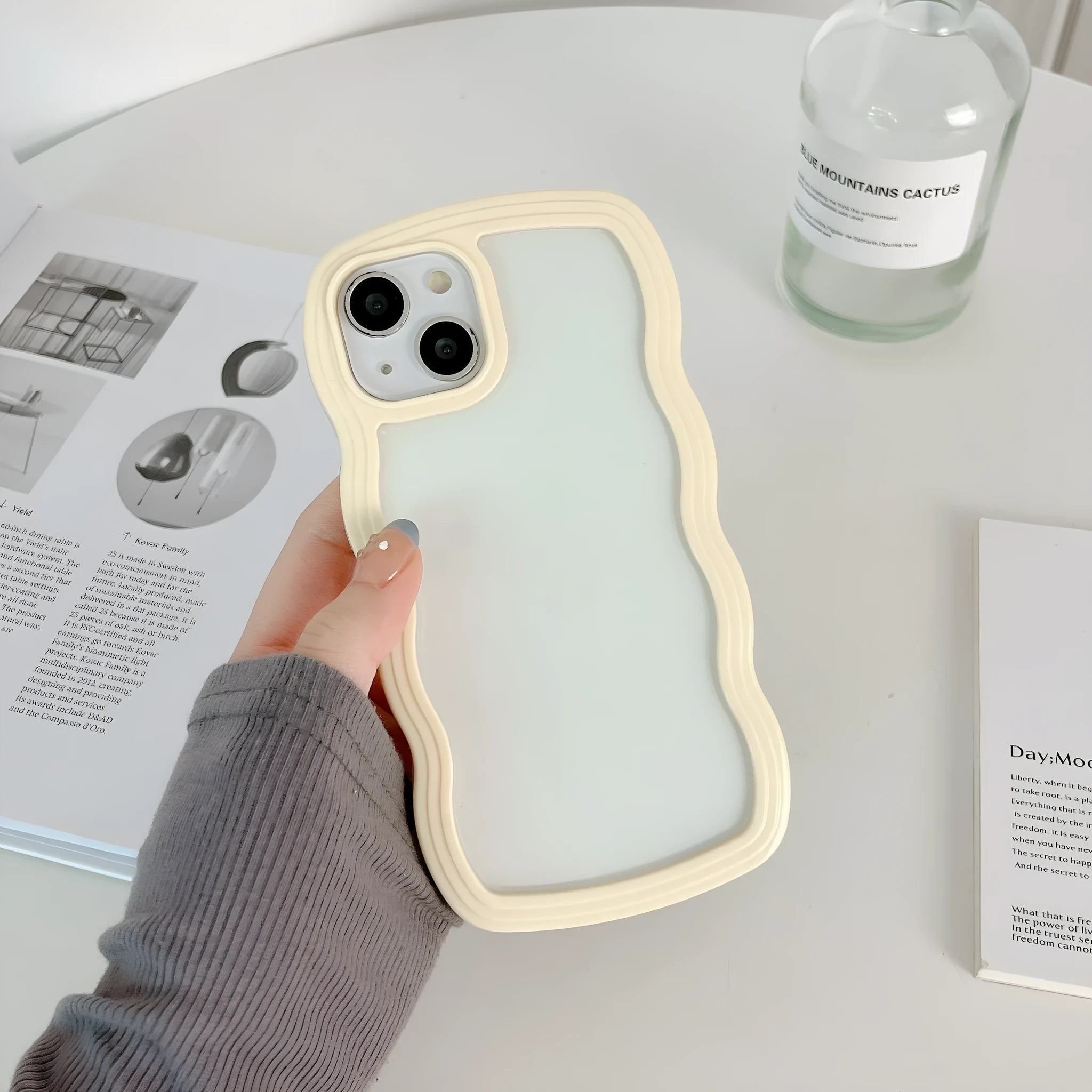 Light yellow wave border TPU phone case for iPhone 16 series, showing rear camera cutout and solid colour finish.