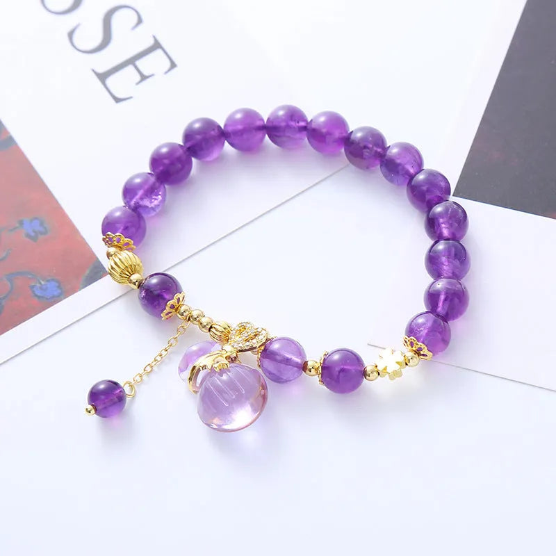 Purple amethyst crystal bracelet with ethnic money bag pendant and peace buckle closure