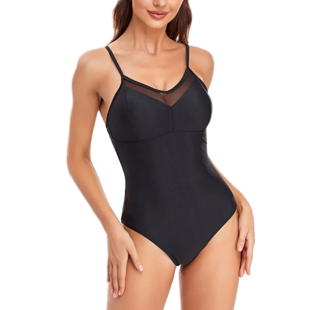 Ladies' solid colour black backless one-piece swimsuit laid flat, showing mesh design and high-cut legs.