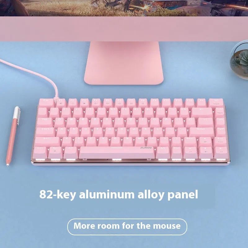 82-key metal mechanical keyboard with white backlight beside laptop