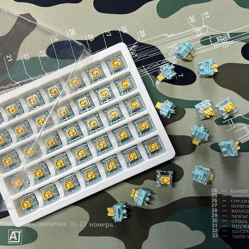36 Sea Salt Lemon coloured PRO Mute keyboard switch shafts arranged in a pack.