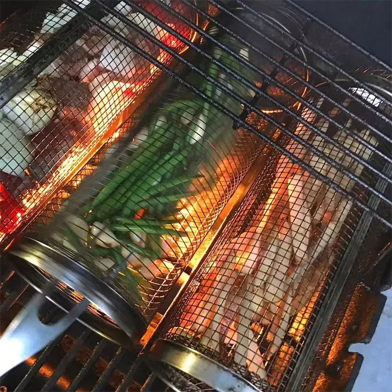 A cylindrical iron wire mesh rolling barbecue basket with a metal hook for handling.