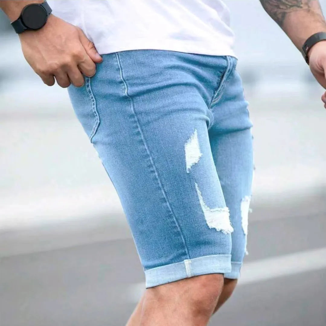 Sky blue men's denim shorts with multi-hole manual wear distressing and low waist straight cut
