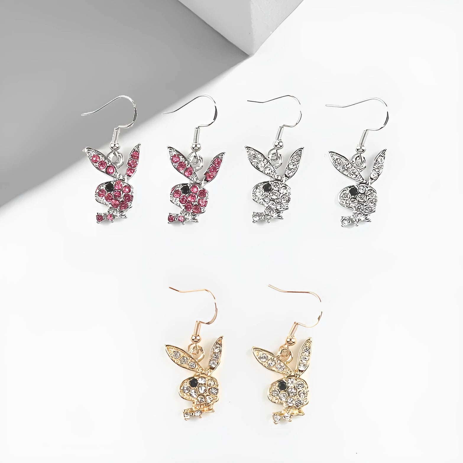 Small silver rabbit stud earrings with sparkling cubic zirconia stones and butterfly back on a white background.