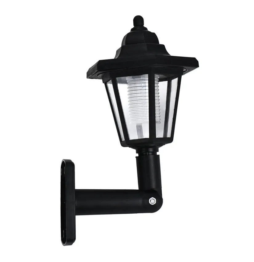 Black hexagonal solar wall light with solar panel for outdoor garden installation