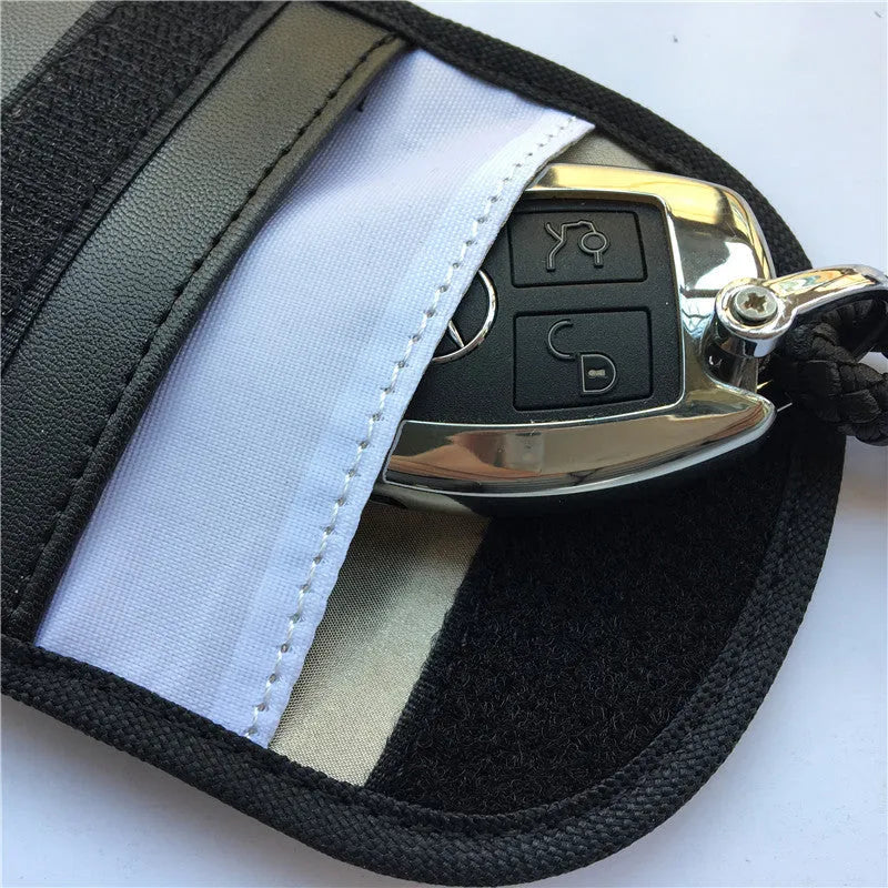 Black signal blocking pouch for car key fob protection measuring 20x10cm