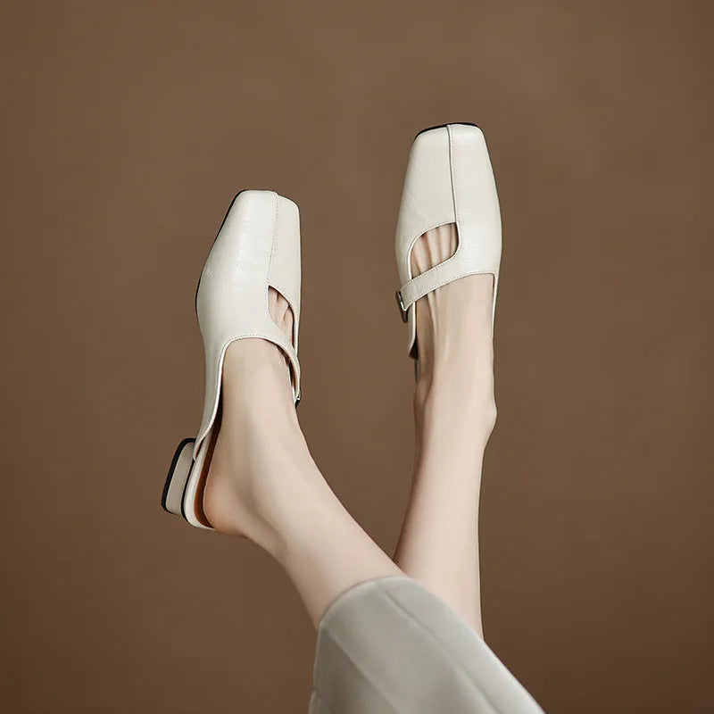 British style square toe outdoor slippers in beige with a low heel and rubber sole.
