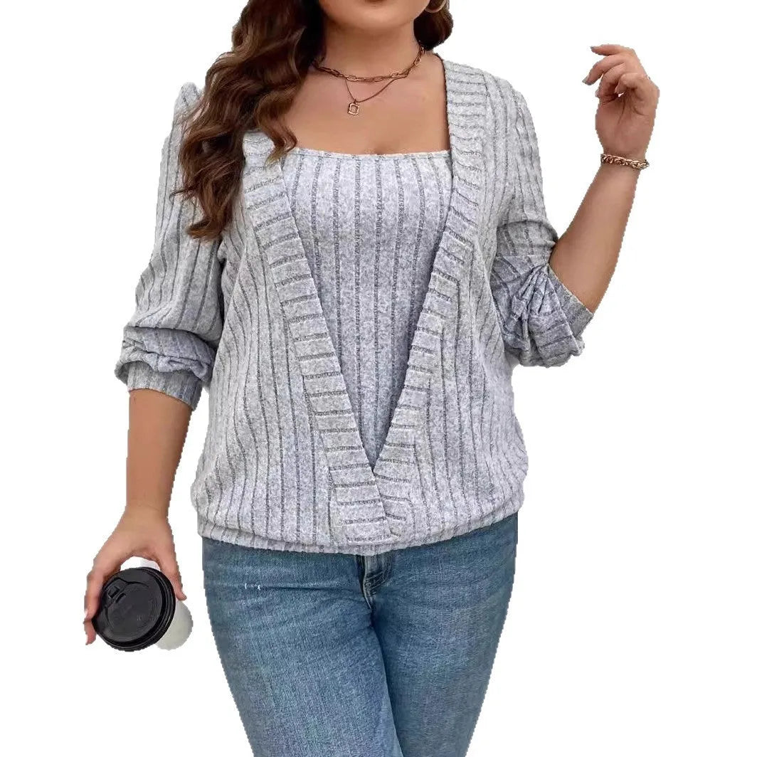 Woman wearing a solid purple V-neck long sleeve faux two-piece suit with a ribbed texture and loose fit.