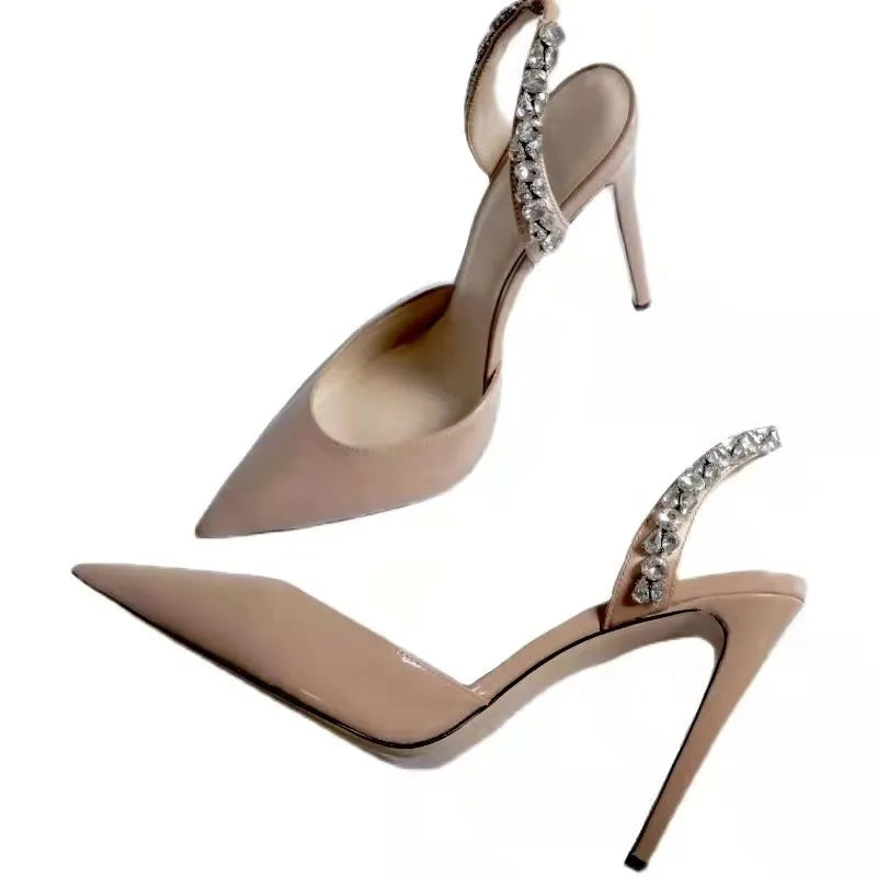 Women's black patent leather pointed toe high heel sandals with side rhinestone decoration.