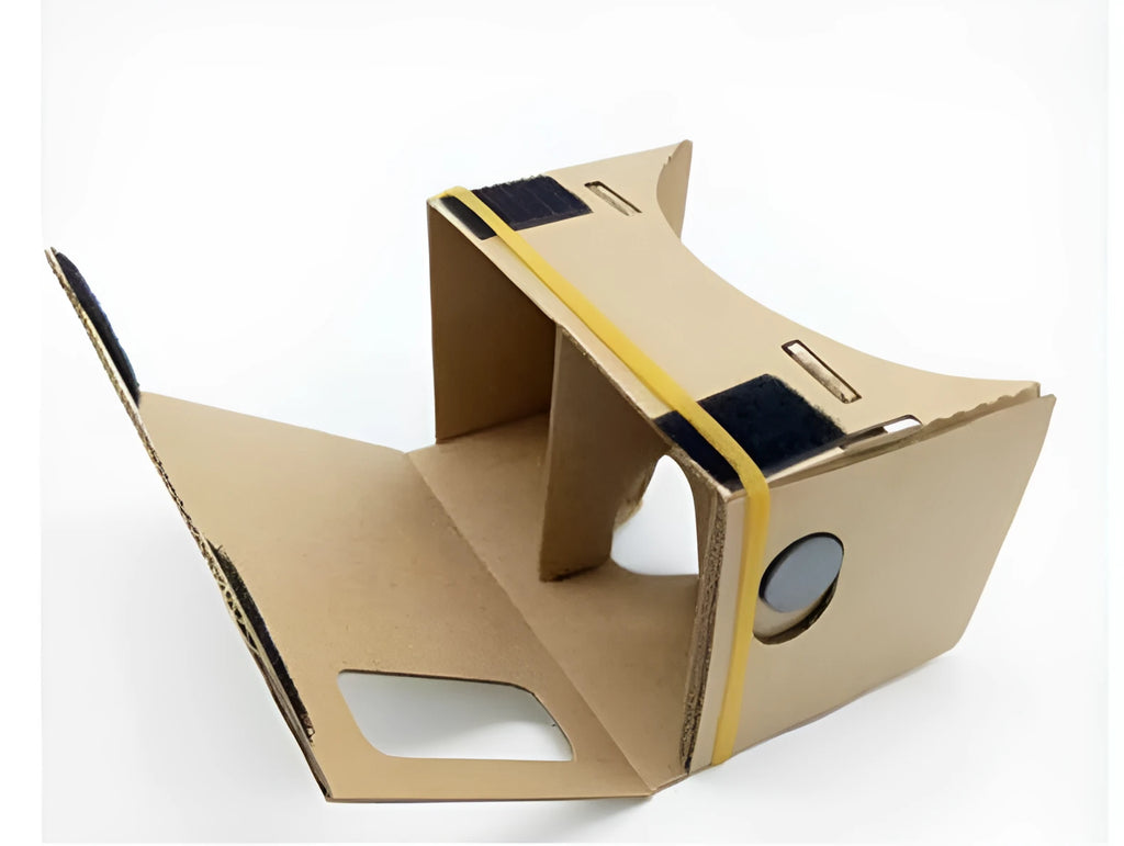 Pink and white flat-pack cardboard VR glasses viewer for smartphones with 3D lenses and straps.
