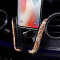 Car buckle mobile phone holder in ABS plastic on a car dashboard with a smartphone in place