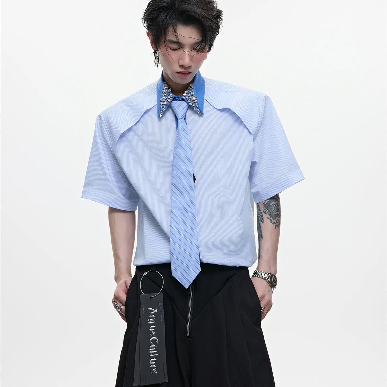 Men's blue and khaki loose fit shirt with diamond tie and patchwork striped pattern.