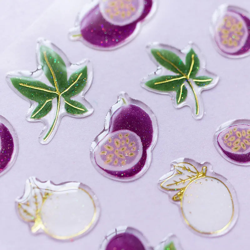 DIY fruit bronzing sticker set showing grape, orange, passion fruit, peach, pineapple, and strawberry designs