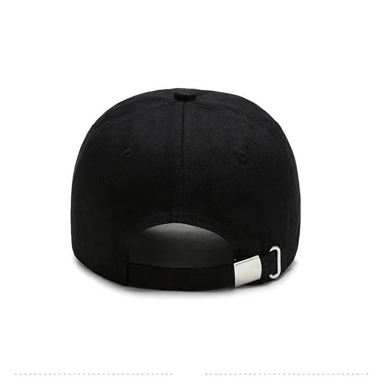 Cotton baseball cap with embroidered cartoon pattern in black, side view, unisex adjustable design