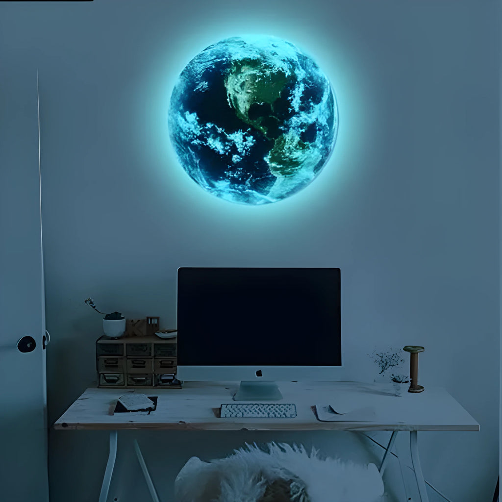 Glow in the dark 3D planet Earth wall sticker in various sizes on a blue wall