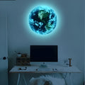 Glow in the dark 3D planet Earth wall sticker in various sizes on a blue wall