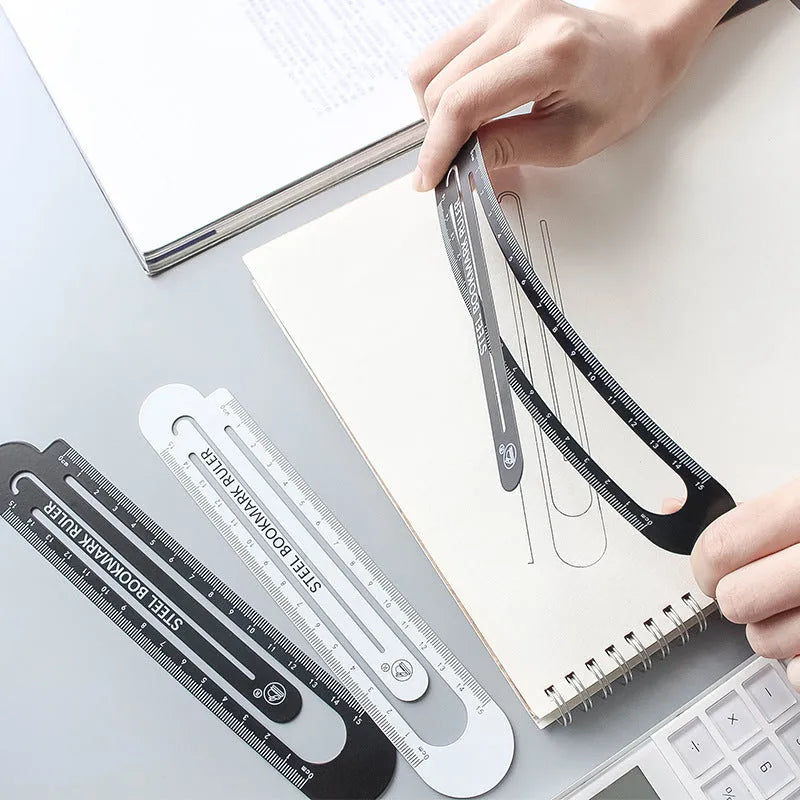 Black and white two-sided ruler showing 12cm length with manganese steel construction