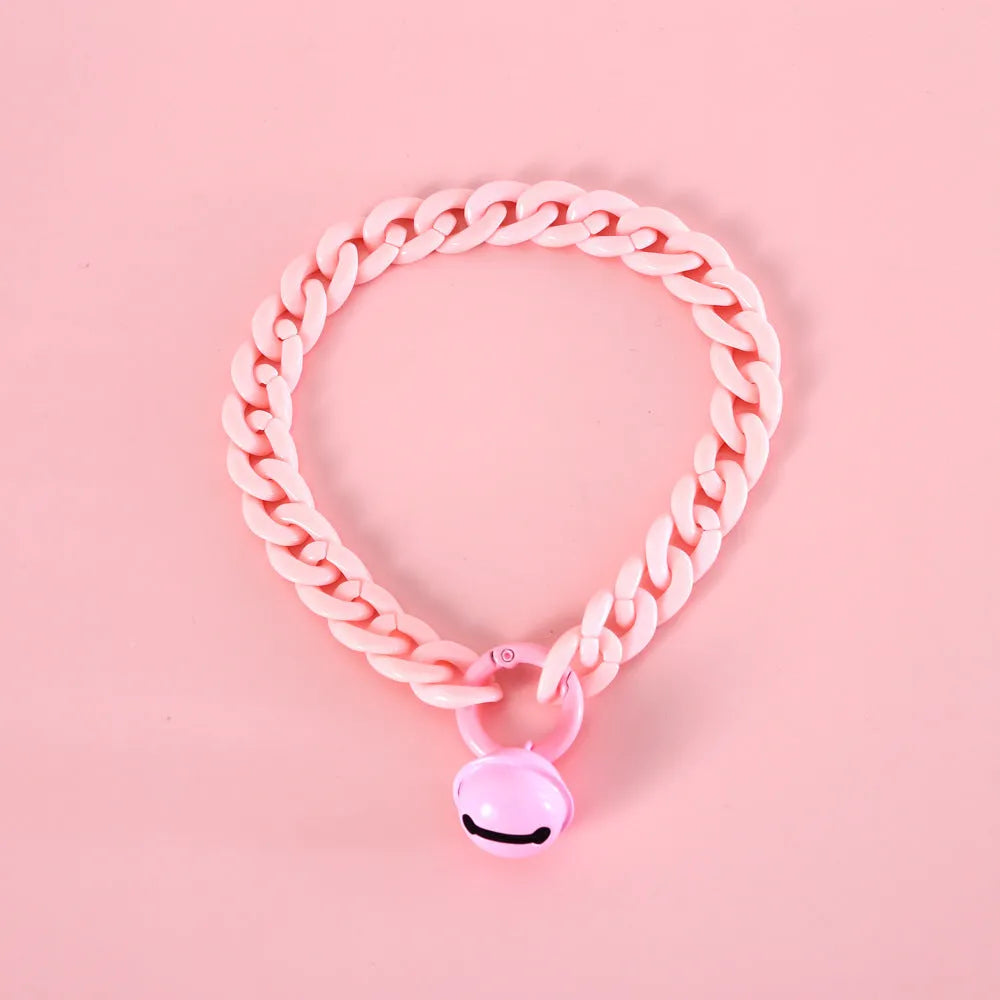 Soft plastic pet collar in pastel macaron candy colours with a chain-link design, shown in S and M sizes.