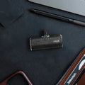 Black pocket leather power bank with lipstick design, 2700mAh capacity, compact size