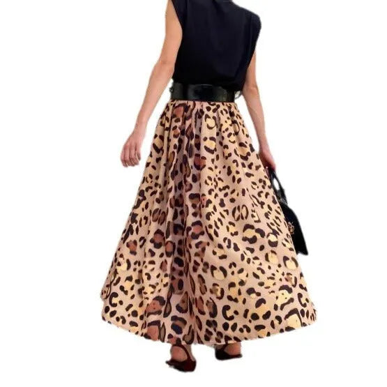 Brown leopard print women's A-line long skirt with a wide flowing hem on a model.