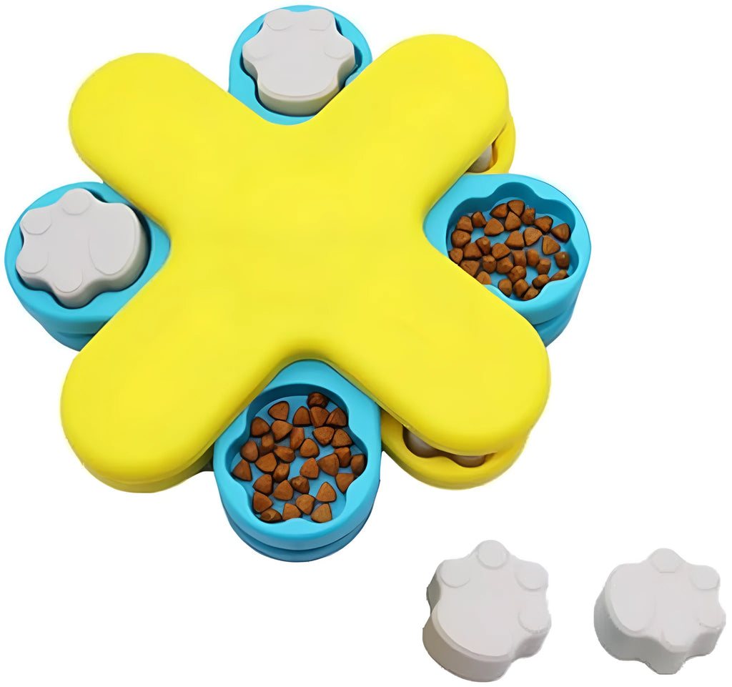 Yellow three-layer rotating dog puzzle feeder toy with anti-slip rubber base on a floor.