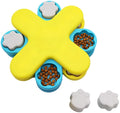 Yellow three-layer rotating dog puzzle feeder toy with anti-slip rubber base on a floor.