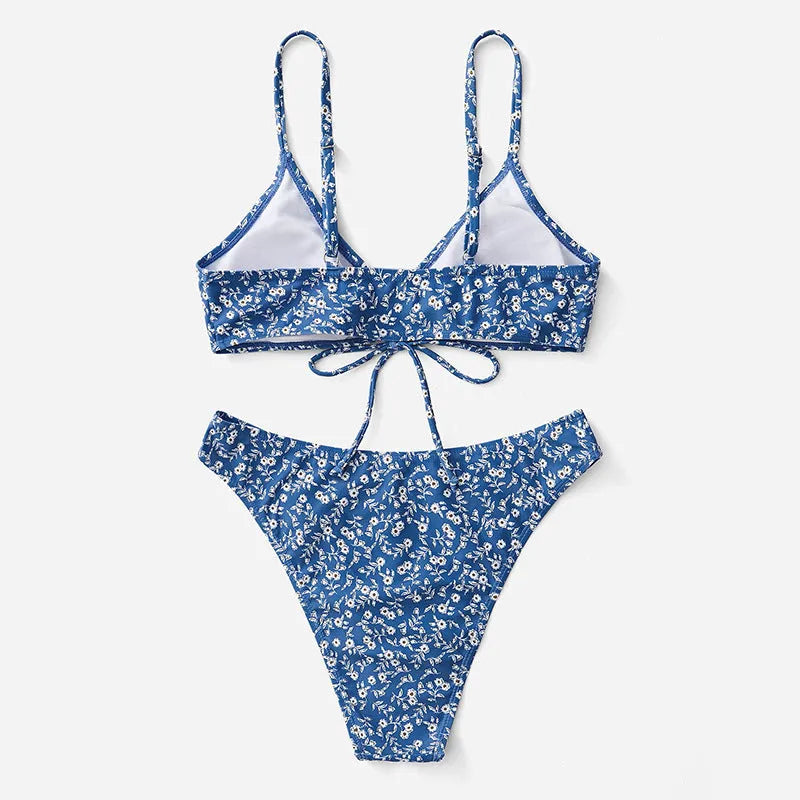 Blue women's three-piece swimsuit set comprising a top and shorts on a mannequin.