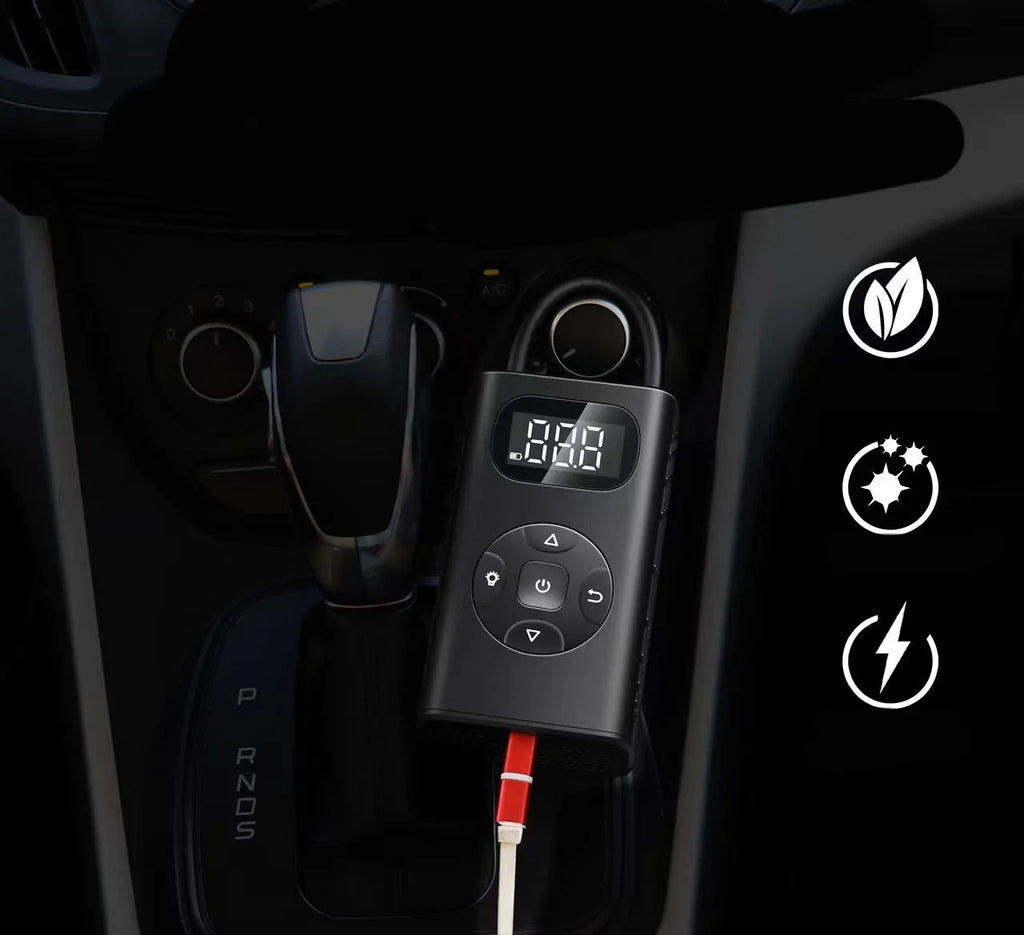 Black portable digital tyre inflator with LCD screen and flexible hose on a black aviation aluminium case.