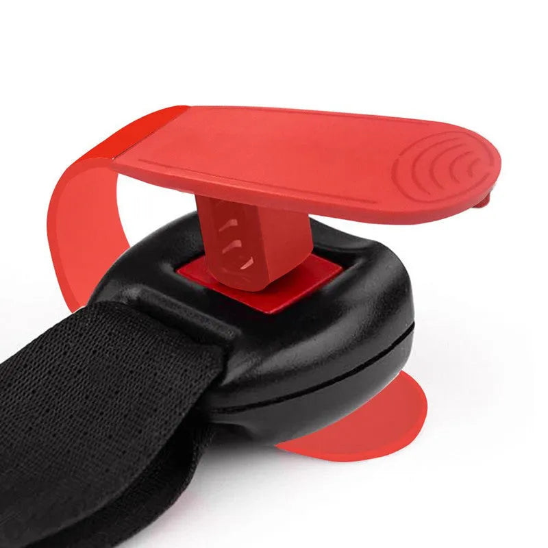 Red ABS coated car seat buckle unlocker measuring 4 x 9 cm on a keyring