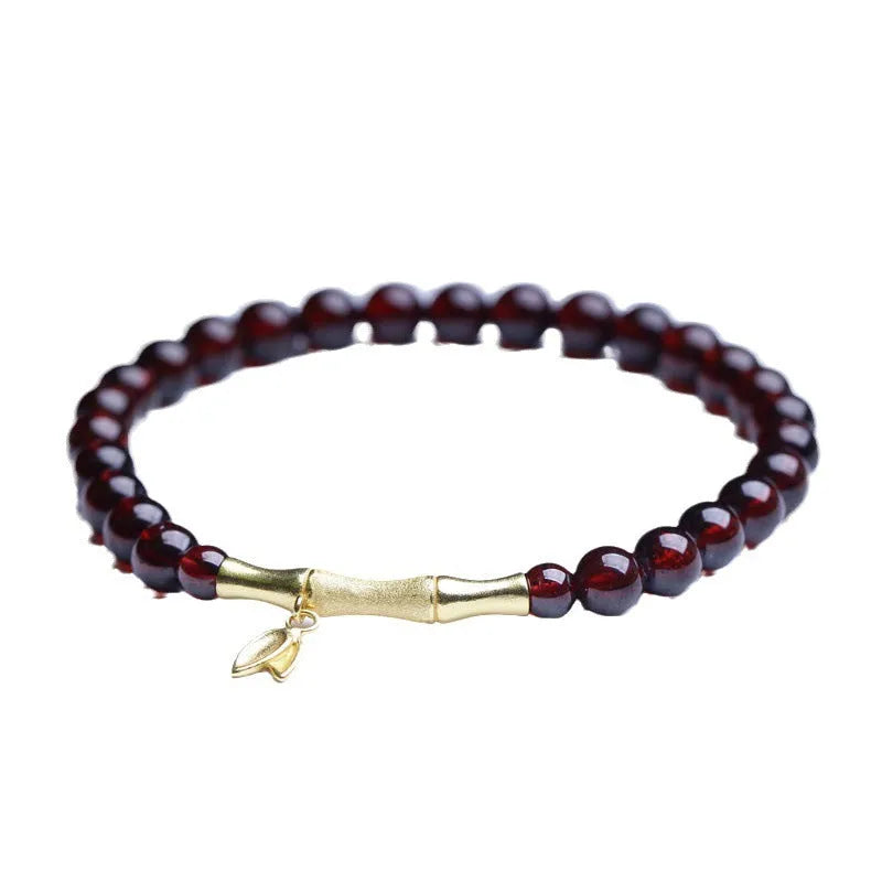 Handmade natural garnet bracelet with a 6mm silver or copper bamboo joint centrepiece.