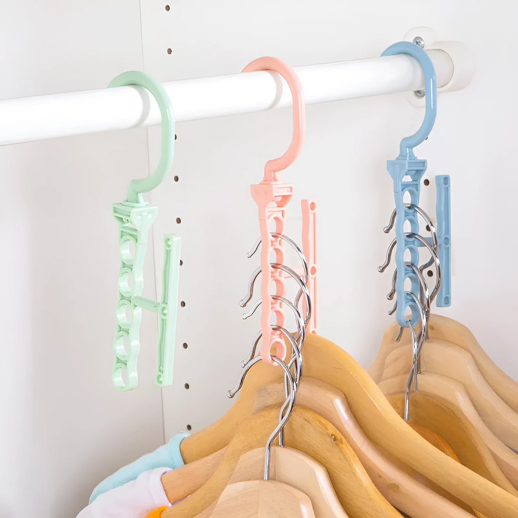 Blue revolving wardrobe hanger with five plastic branches and central handle for clothes organisation