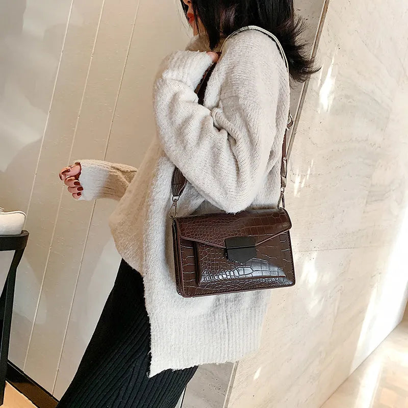 Vintage-style PU leather crossbody bag in black, shown with dimensions for scale.