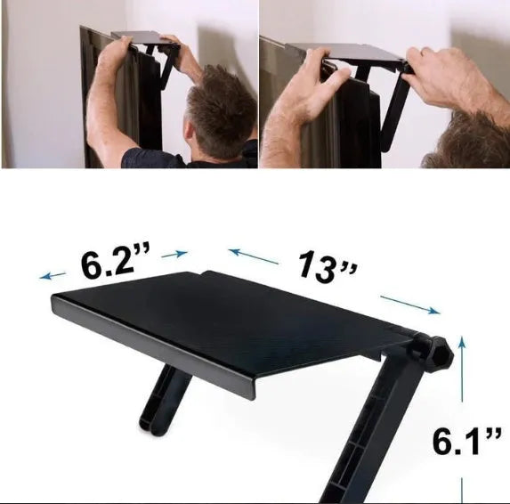 Black adjustable screen top shelf on a desktop monitor holding a streaming device and remote