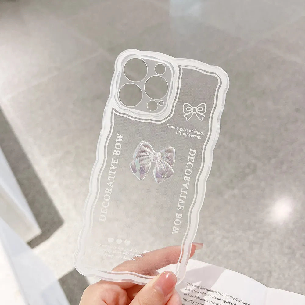 Clear flexible iPhone case with a raised 3D ice-through bow design on the back.