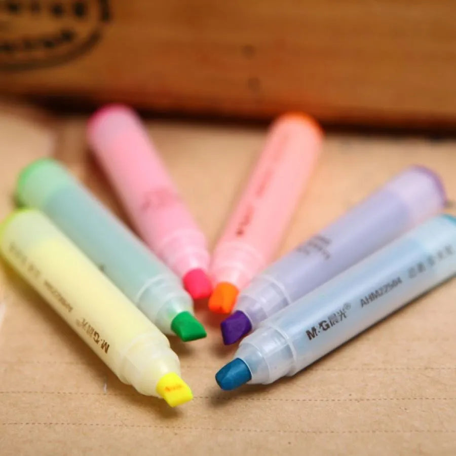 Set of six plastic barrel highlighter pens in yellow, pink, blue, green, orange, and purple colours with oblique tips