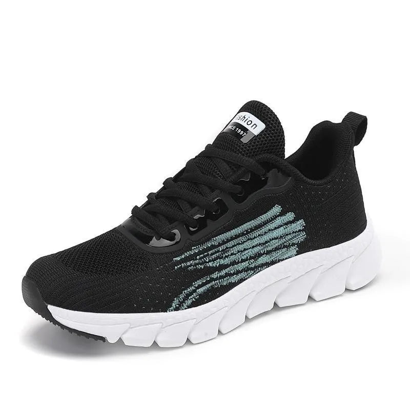 Women's low-top black and white casual running sneakers with MD sole and cross-strap detail.