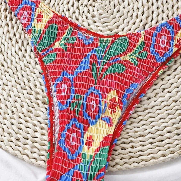 Red floral print women's underwire two-piece bikini swimsuit on a mannequin.