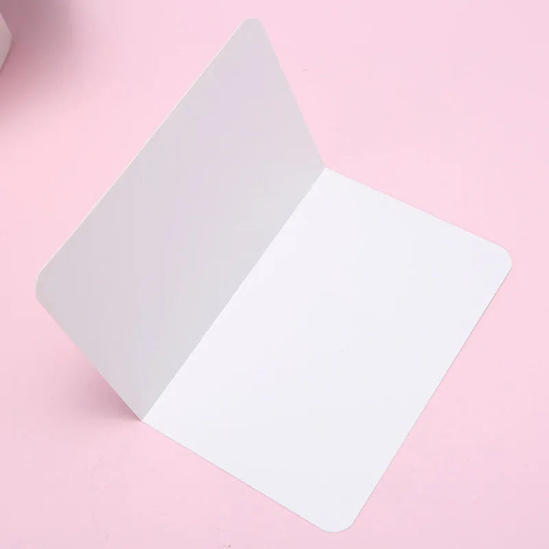 Pack of 100 blank A6 kraft paper folded cards in black, white, and natural brown colours
