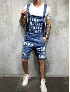 Men's black braces ripped jeans jumpsuit with adjustable shoulder straps on a model