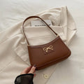 Western-style shoulder bag with bow decoration in multiple colours showing 24x14x5cm dimensions