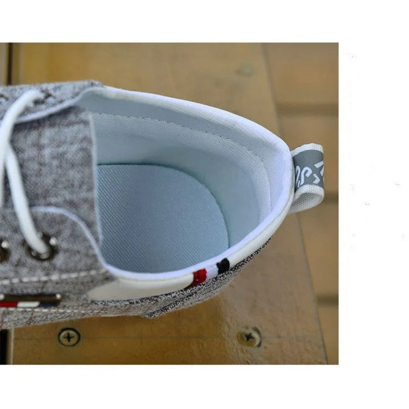 Men's black hemp sailing shoes with grid pattern and car stitch detail on a flat sole