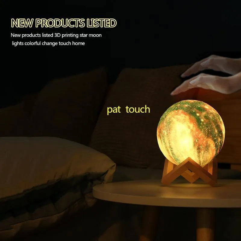 3D-printed spherical lunar night light on a surface, showing its colour-changing LED glow and remote control.
