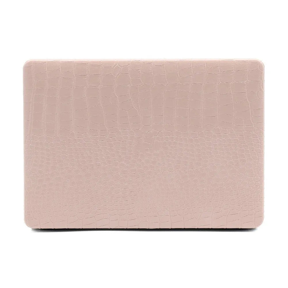 MacBook laptop case in soft pink with a textured crocodile pattern and a hollowed-out Apple logo on the lid.