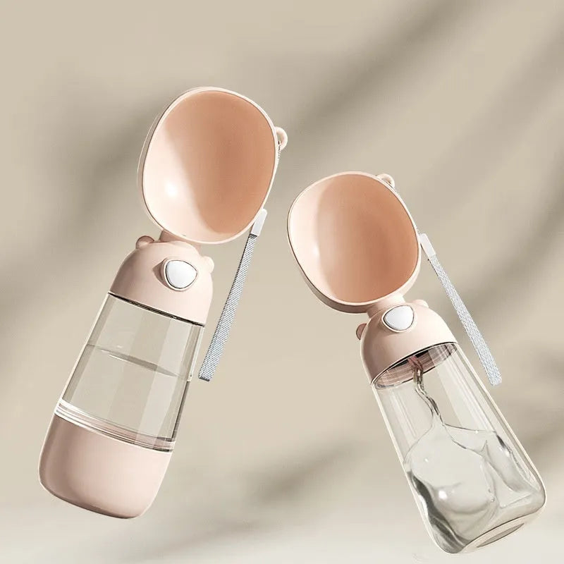 Portable dog water bottle and feeder bowl in brown, pink, or yellow colours.
