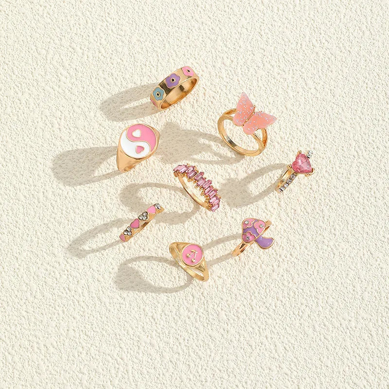 Set of 8 zinc alloy colour dripping rings with plant and flower motifs in European style