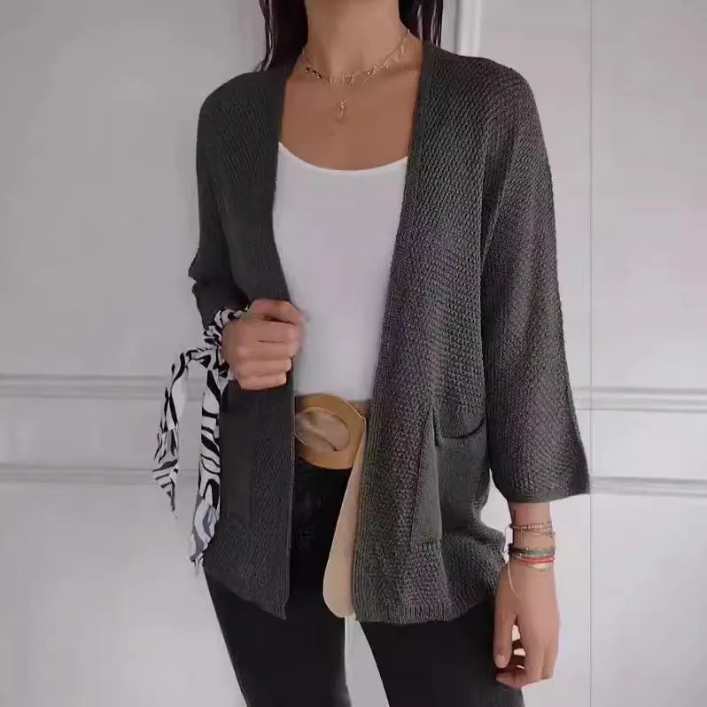 Women's waffle texture cardigan coat with nine-quarter sleeves shown in army green colour.